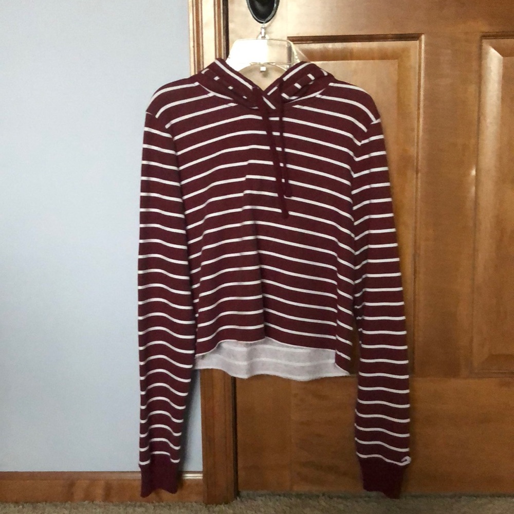 Burgundy and white striped cropped hoodie.